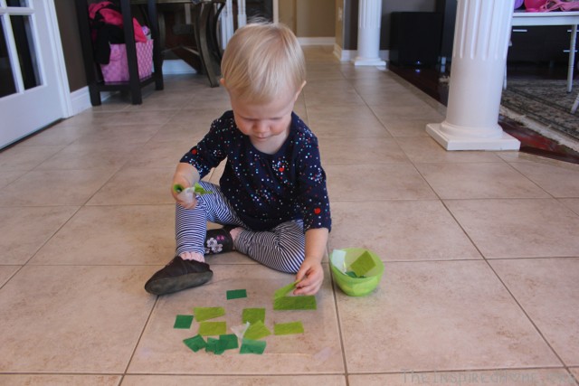 Make shamrocks this St. Patrick's Day using contact paper and tissue paper. The perfect toddler craft! From TheInspiredHome.org