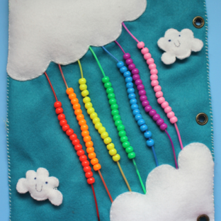 TheInspiredHome.org // Quiet Book Pages: Rainbow Bead Page Tutorial. A felt quiet book page including puffy clouds and strands of bright, colorful beads. Ideal for older babies and younger toddlers.