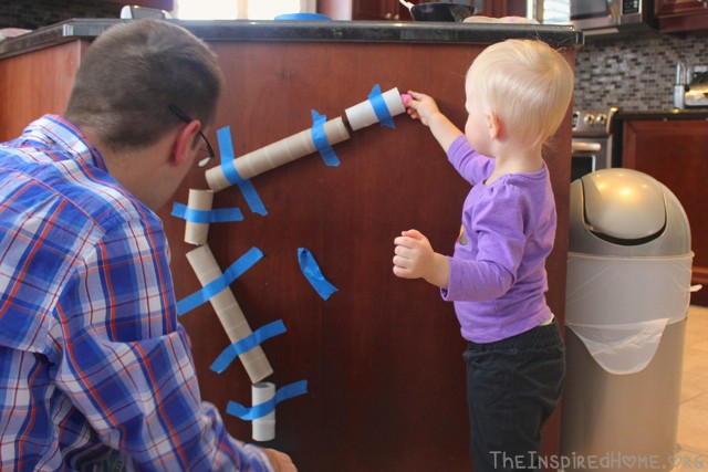 Pom Pom Tunnels are a great way to teach toddlers all about physics, building, fine motor skills and cause & effect! Tutorial from TheInspiredHome.org