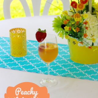 TheInspiredHome.org // Peachy White Wine Sangria. A delicious summery sangria made with Pinot Grigio, peach schnapps, raspberry sourpuss and more!