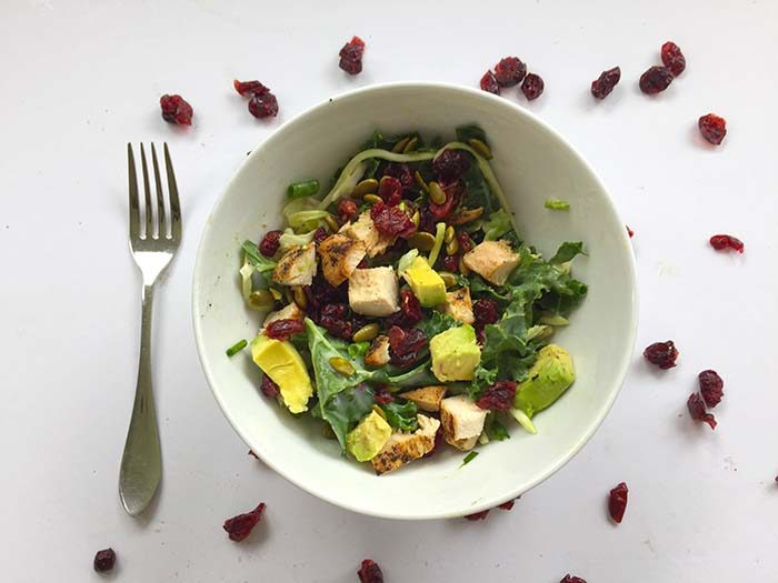 TheInspiredHome.org // Kale Salad with Cranberries. A quick kale salad with cranberries made from Sweet Kale gourmet vegetable salad kit, avocado, grilled chicken breast, and fresh herbs.